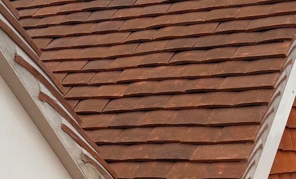 Clay plain tiles laid in straight courses on a Day Roofing job